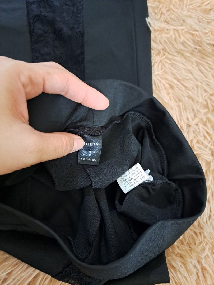 SHEIN black pants with lace side panels size M (Category: Jeans) located in Manila. Submitted by kayliz.7 (Listing ID 1470012530, Image 2). Description: - Brand: SHEIN - Size: M (EUR 38, US 6) - Color: Black - Design: Unique lace panel running down the legs - Origin: Made in China - Care Instructions: Hand wash recommended, do not bleach, do not tumble dry, cool iron if needed.