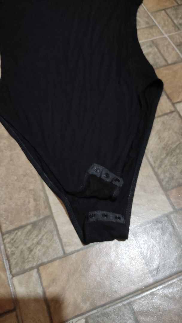 SHEIN Black Short Sleeve Bodysuit Size S (Category: Blouses) located in Mangatarem. Submitted by itsumo_kokoro (Listing ID 1469983021, Image 3). Description: - Brand: SHEIN - Style: Short sleeve bodysuit with a simple scoop neckline - Color: Black - Size: Small (tag attached) - Closure: Snap button at the bottom gusset - Condition: Excellent, clean fabric with no stains or damage -used once .