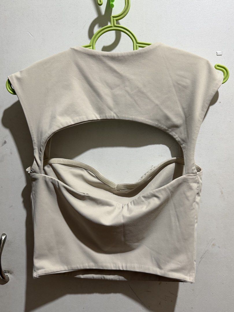 SHEIN Crop Top Size M (Category: Sleeveless) located in Makati City. Submitted by grungygurl (Listing ID 1470098457, Image 2). Description: - SHEIN - Size: M (EU 38, US 6) - Beige - Cutout back with built-in supportive band in front.