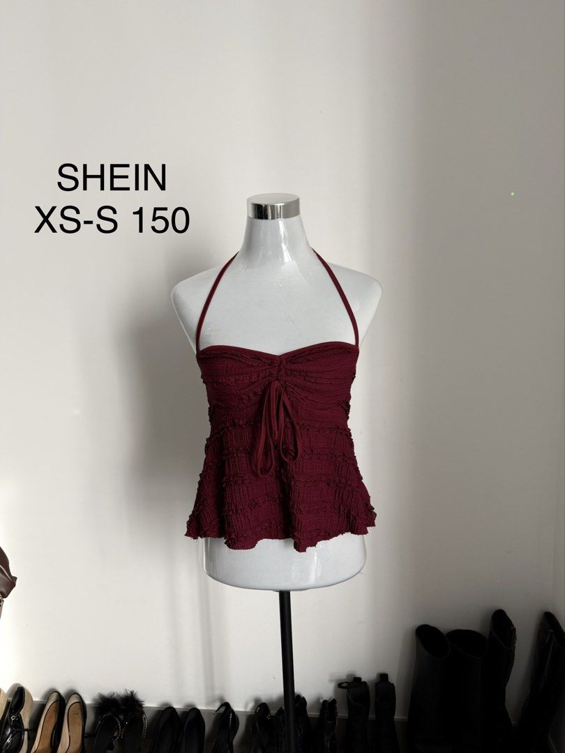 SHEIN Halter Ruched Top White XS-S (Category: Sleeveless) located in Manila. Submitted by janalulu (Listing ID 1469970254, Image 2). Description: - Brand: SHEIN - Size: Fits XS to S - Color: White - Style: Halter top with adjustable straps and flared hem - Details: All-over ruched texture with a cute front tie - Condition: Great, easy to pair with jeans or skirts for warm weather.