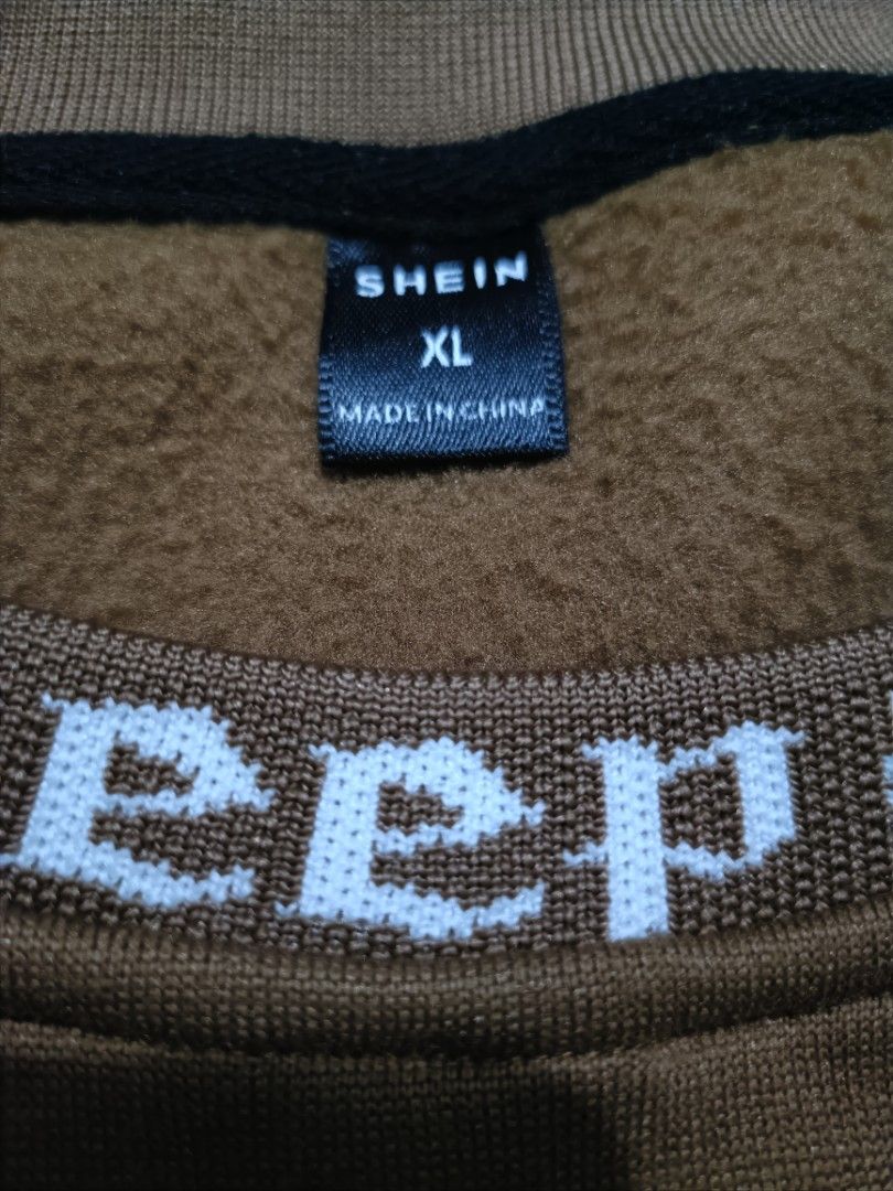 SHEIN Keep Smile Brown Sweatshirt Size (Category: Coats, Jackets and Outerwear) located in Manila. Submitted by quartz.rewind (Listing ID 1470111486, Image 3). Description: "🔥 10% OFF if you buy any 2 items! / 15% OFF for 3+ items. Shipping can be combined to save you money. Valid this week only!" Description: Up for grabs is a cozy coffee-brown crewneck sweatshirt from SHEIN. Features a unique white gothic text detail knitted along the collar r