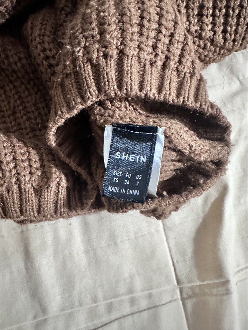 Shein Knit Sweater (Category: Coats, Jackets and Outerwear) located in Quezon City. Submitted by hennessyscloset (Listing ID 1470114492, Image 2). Description: Preloved Knit Sweater, actual color is brown. No flaws, needs wash since it was stocked for almost a year (while I’m pregnant) XS on tag but can fit up to Small Rfs: Decluttering, no longer fit on me.