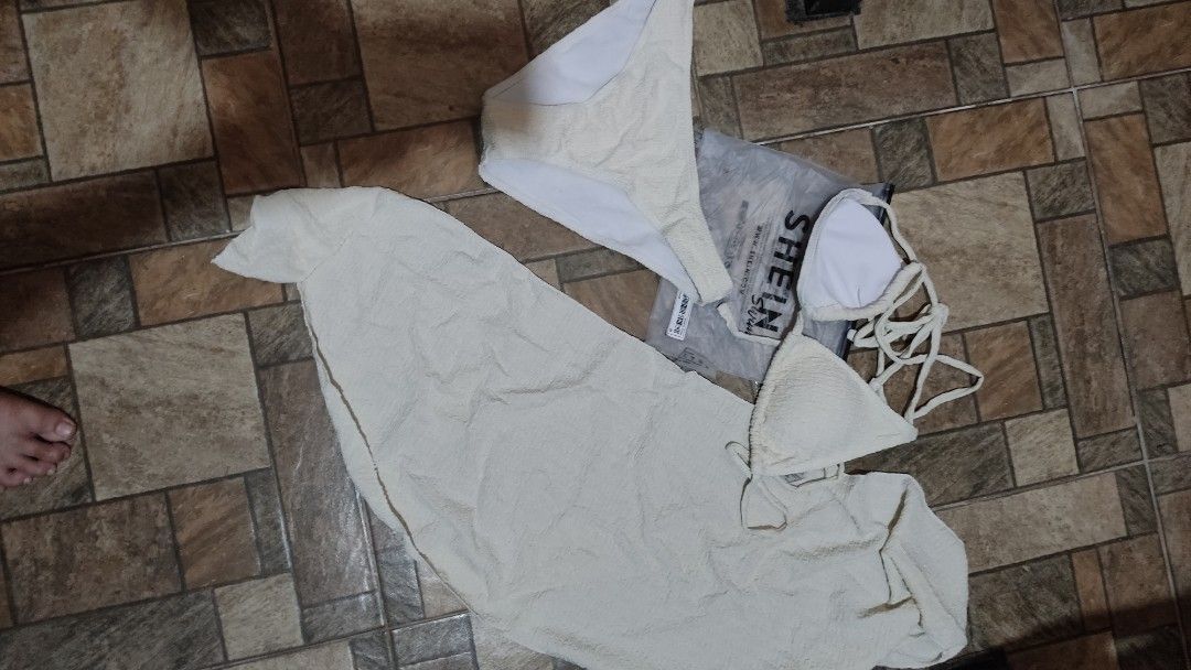 SHEIN Textured Bikini Set with Sarong Size M (Category: Bikinis & Swimsuits) located in Mangatarem. Submitted by itsumo_kokoro (Listing ID 1469987938, Image 1). Description: - Brand: SHEIN - Item: 3-Piece Bikini Set with Matching Sarong Wrap - Color: Cream (Textured Fabric) - Size: M - Material: 95% Polyester, 5% Elastane - Inclusions: Triangle top with ties, matching bottom, sheer wrap skirt, and original ziplock packaging - Condition: Brand new