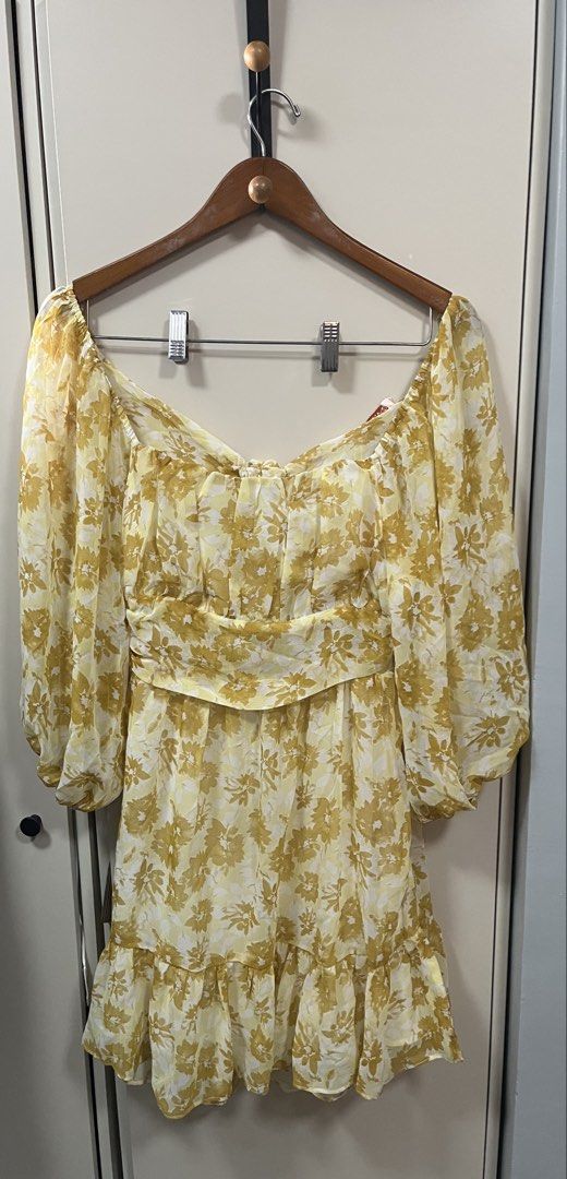 Shellvio Yellow Floral Dress with Bow (Category: Dresses) located in Manila. Submitted by bonita1209 (Listing ID 1469984600, Image 2). Description: - Brand: Shellvio (Brand New with Tags) - Design: Yellow floral print with square neckline and puff sleeves - Details: Ruffled hem and back tie with a chic cut-out design - Comfort: Fully lined for a premium fit - Perfect for: Casual days out, dates, or weekend events.