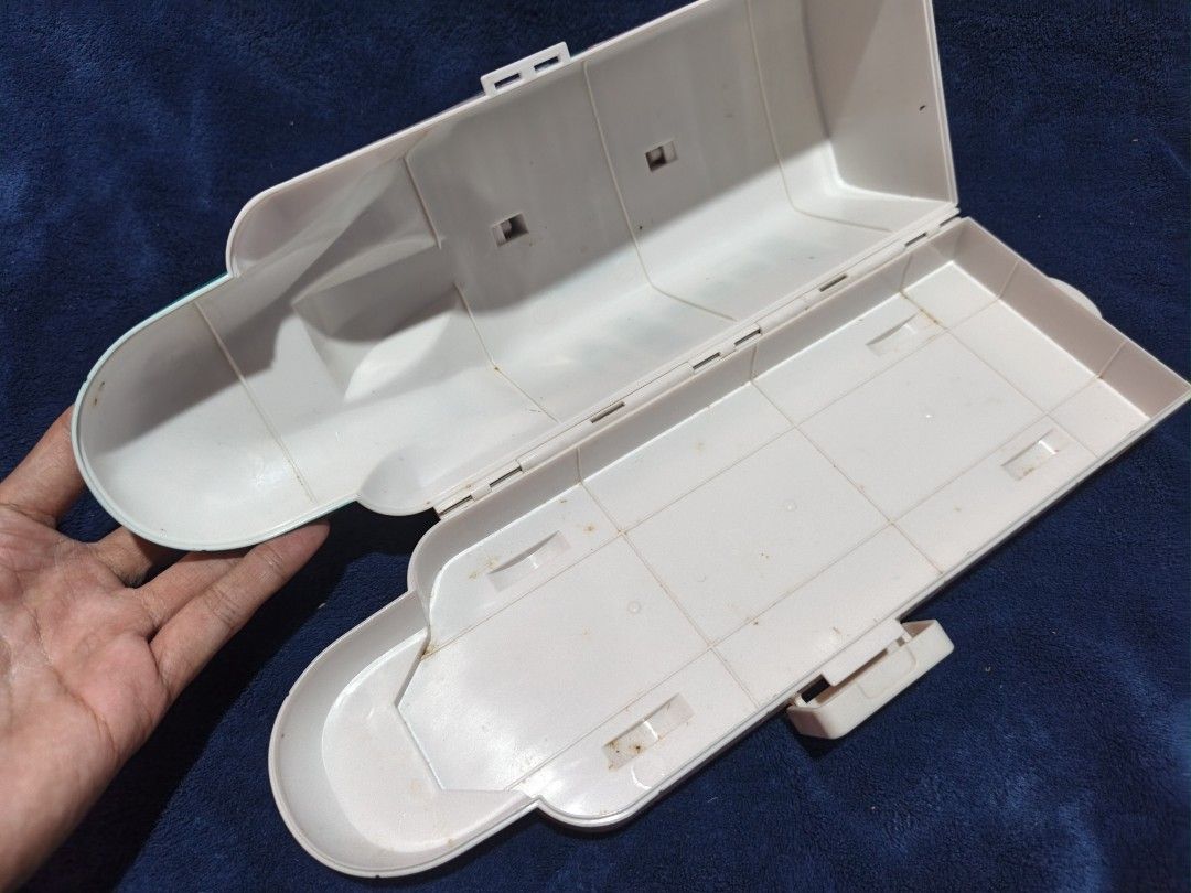 Shinkansen Bullet Train Toy Storage Box Carrying Case (Category: Storage Boxes & Baskets) located in Manila. Submitted by kirstentoyshub (Listing ID 1470016435, Image 2). Description: - Green and white Shinkansen bullet train toy storage case - Convenient carrying handle on top and easy side-opening mechanism - Opens up fully, perfect for storing small toys or accessories - Features cool molded switch details on the roof - Condition note: Interio