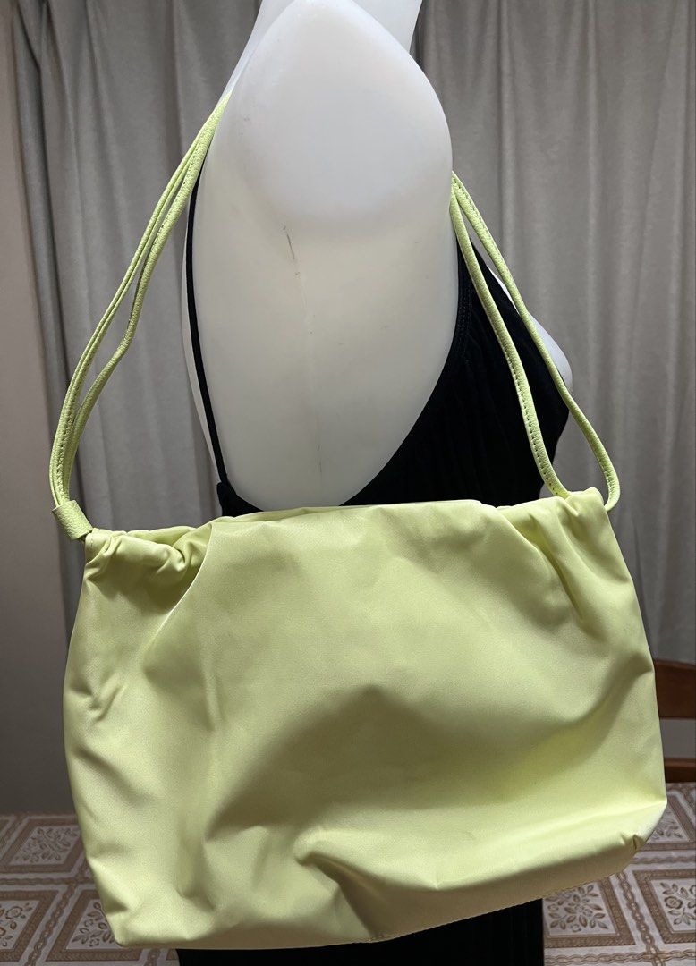 Shoulder bag /hand bag (Category: Shoulder Bags) located in Bacoor. Submitted by ayit. (Listing ID 1470058050, Image 1). Description: Orig new sf inc - Brand: DEANNI - Style: Shoulder bag / Handbag - Color: Pastel yellow - Design: Soft gathered/pleated exterior with slim double shoulder straps - Interior: Clean white fabric lining with an inner zippered pocket - Condition: Excellent, well-maintained.