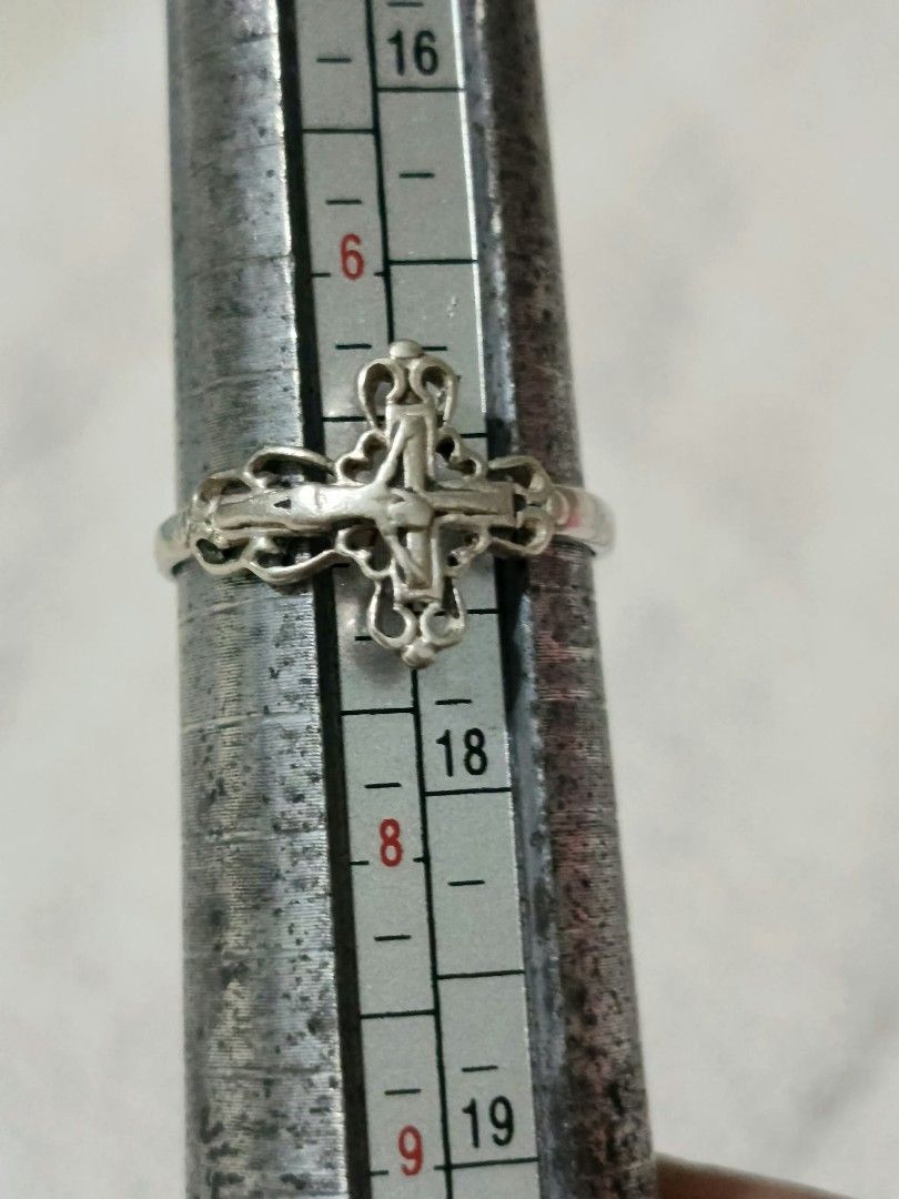 Silver Ornate Cross Ring Size 17 (Category: Rings) located in Abucay. Submitted by thrifty.picked (Listing ID 1470120935, Image 1). Description: - Material/Color: Silver ring - Design: Intricate cross with delicate filigree details along the band and edges - Size: Approximately size 17 on the mandrel - Fit: Slim band style, lightweight, and comfortable for any finger - Condition: Brand new / Excellent (ready to ship).