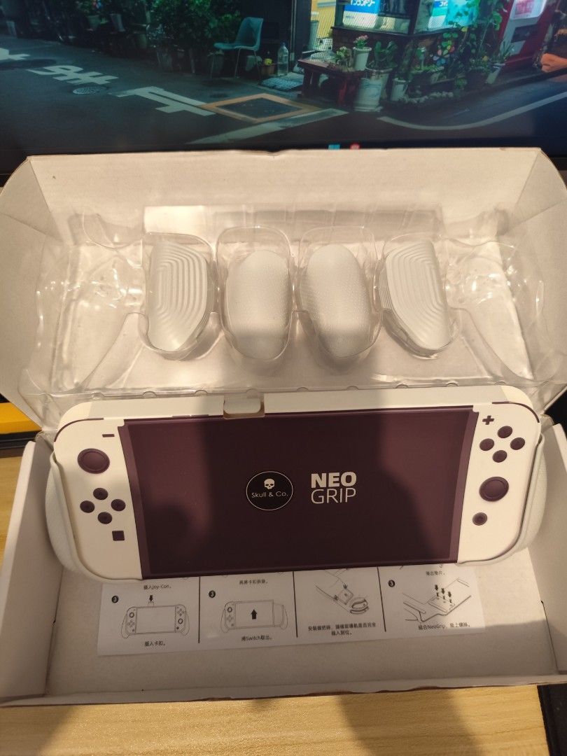 Skull & Co Neo Grip for Nintendo Switch (Category: Controllers) located in Mandaluyong City. Submitted by 061093 (Listing ID 1470087869, Image 2). Description: - Item: Skull & Co Neo Grip for Nintendo Switch (White housing) - Condition: Original packaging included, well-maintained - Includes: Extra grip pairs included in the box - Benefits: Ergonomic design for comfy, fatigue-free long handheld gaming sessions and solid console protection - Meetu