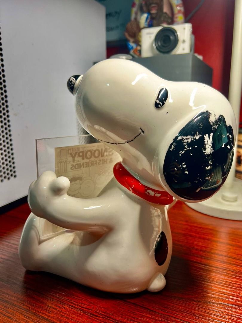 Snoopy Ceramic Figurine BIG SIZE (Category: Figurines & Statues) located in Baguio. Submitted by ditoyzb08176 (Listing ID 1470080155, Image 3). Description: - Vintage Peanuts ceramic figurine featuring Snoopy holding a display plaque - Plaque showcases Snoopy, Charlie Brown, Lucy, and friends with 'SNOOPY & HIS FRIENDS' text - Copyright dated 1950 through 1960 printed at the base - Base is lined with green felt material for surface protection - W