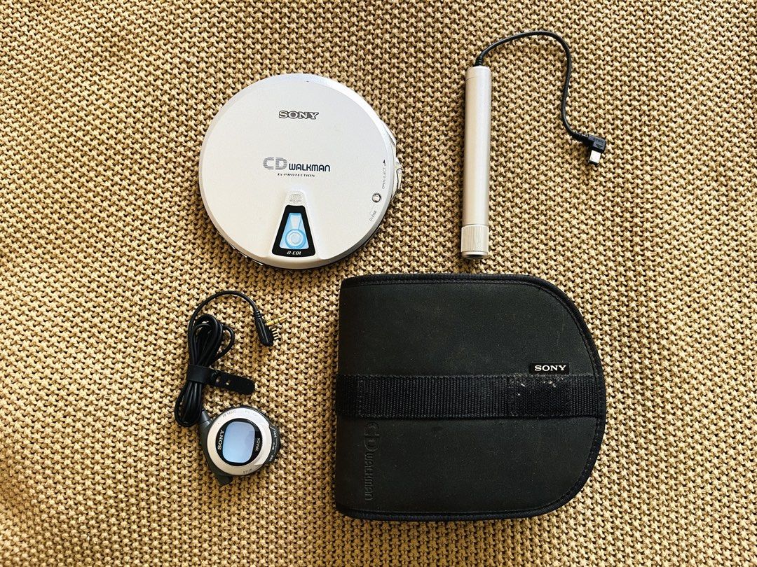 Sony CD Walkman D-E01 Portable Player (Category: Portable Music Players) located in Rizal. Submitted by ndvxvnty (Listing ID 1469962201, Image 2). Description: - Model: Sony CD Walkman D-E01 Portable Disc Player (Walkman’s 20th Anniversary CD player - released in 1999) - Slide in mechanism : Instert the CD through the little door to play the CD - Color: Silver - Power: 2 gum stick batteries (tested 2-3 hours playback time. Drains so much battery)