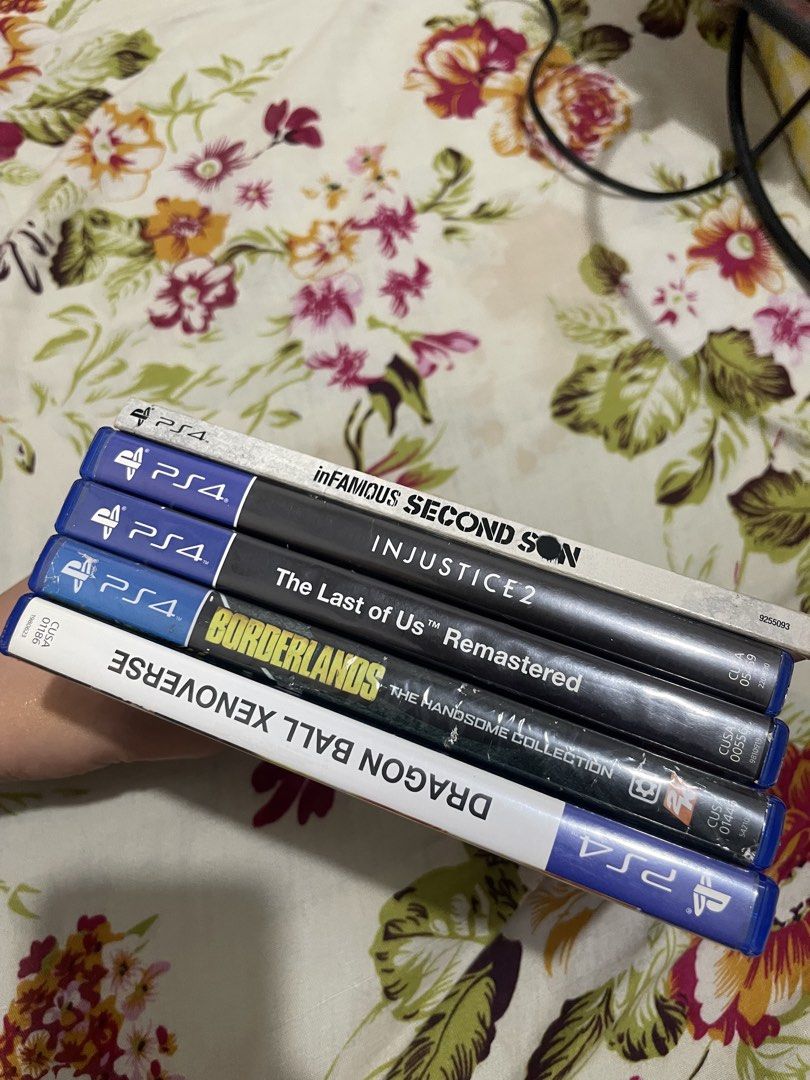 Sony PlayStation 4 Console with 2 Controllers and 5 Games (Category: PlayStation) located in Dasmarinas. Submitted by dtwybnrnnm04940 (Listing ID 1469987633, Image 3). Description: PS4 Bundle - 2 Original DualShock 4 Controllers - HDMI Cable - Power Cable Games: TLOU ‎Injustice 2 ‎Xenoverse ‎Borderlands ‎Infamous Issue: kukang ng isang screw sa likod Pm me if tatawad pa.