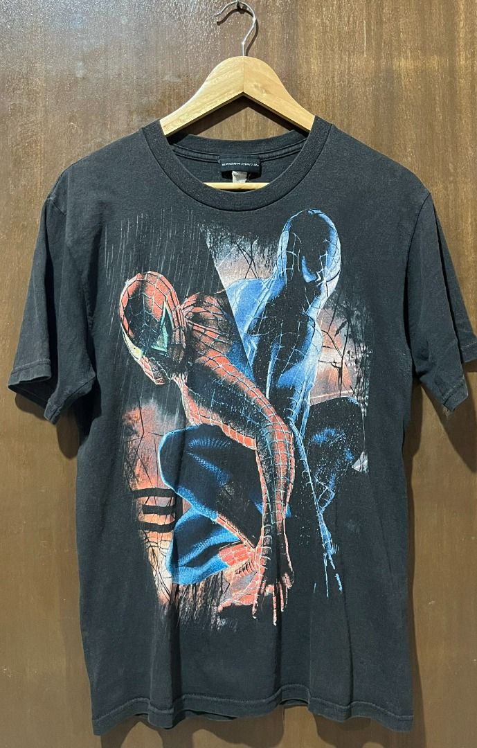 Spiderman 3 Movie Poster (Category: Tshirts & Polo Shirts ) located in Bacolod City. Submitted by backtrack.vtg (Listing ID 1470089899, Image 1). Description: - Dark grey Spider-Man graphic tee - Large classic comic book artwork in red and blue on the front - Soft cotton material with natural fading and wash wear for a vintage aesthetic - Short sleeves with a standard crew neck fit - Tagged at the inside collar.