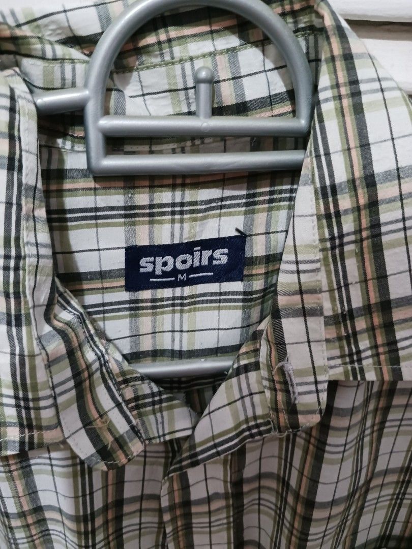 Spiors plaid long sleeve button up shirt medium (Category: Longsleeves) located in Quezon City. Submitted by rdonelle (Listing ID 1470095300, Image 2). Description: - Brand/Style: Spiors long sleeve button-up shirt - Pattern: Classic plaid in green, white, black, and peach tones - Size: Medium (tag on collar label) - Features: Standard front button closure with a single chest pocket - Condition/Use: Great for casual everyday wear or layering.