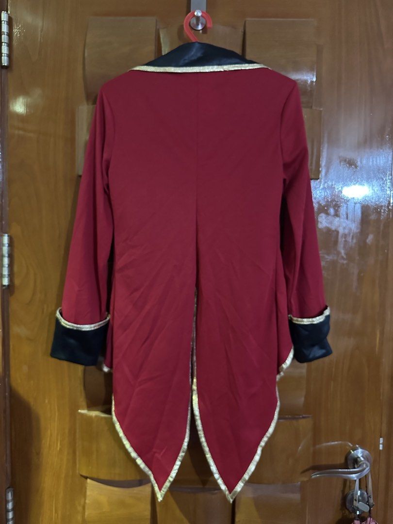Spirit Halloween Red Ringmaster Coat Tween Large (Category: Babies & Kids Fashion) located in Muntinlupa City. Submitted by belica (Listing ID 1470092151, Image 2). Description: - Brand: Spirit Halloween - Size: Tween Large - Design: Red ringmaster jacket with swallowtail back, black collar and cuffs with gold trim, and gold scroll patterns on lapels - Material: 100% polyester (spot clean only) - Condition: Stored clean and ready to wear - Ideal 