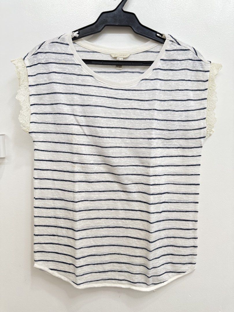 Springfield Striped Lace Sleeve Tee (Category: Shirts) located in Quezon City. Submitted by reivia.vend (Listing ID 1469987449, Image 1). Description: - Brand: Springfield - Color: White and navy stripes - Material: Lightweight knit fabric - Fit: Regular - Design: Short sleeves with delicate lace shoulder panels, round neckline, and curved hemline - Condition: Flawed with a couple of small yellowish stains on the front lower area, otherwise plent