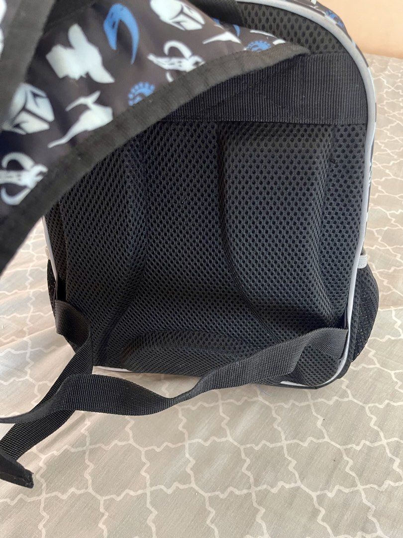 Star Wars Stormtrooper Holographic Kids School Backpack (Category: Babies & Kids Fashion) located in Quezon City. Submitted by shopalluwantbyr (Listing ID 1469982980, Image 3). Description: - Authentic Star Wars backpack with holographic Stormtrooper graphic - All-over pattern featuring Mandalorian helmets, Rebel symbols, and Starfighters - Dual zippered main compartment and front pocket with branded metal pulls - Convenient mesh side pockets for