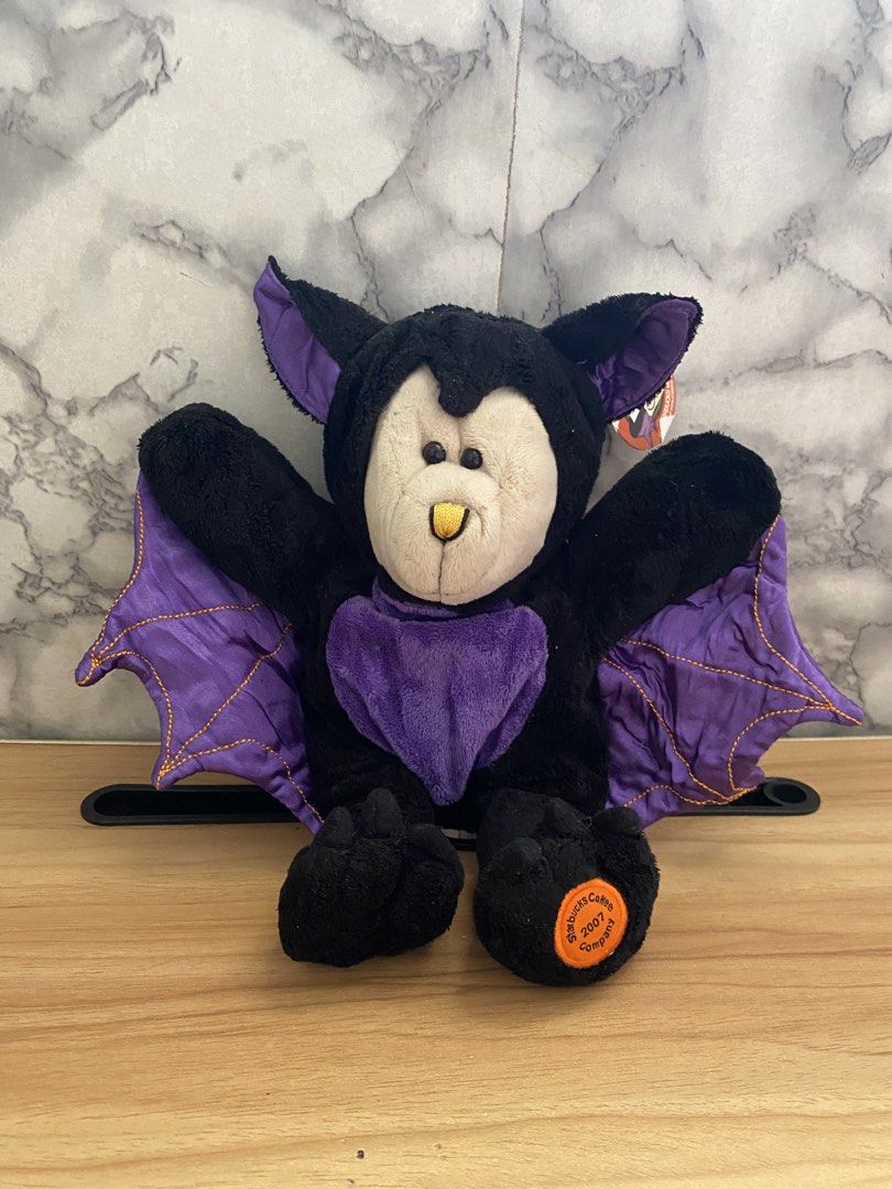 Starbucks Bearista Bear 65th Edition Vampire Bat (Category: Plushies & Soft Toys) located in Caloocan City. Submitted by izzyjelly (Listing ID 1470000615, Image 1). Description: - Rare 2007 Starbucks 65th Edition Bearista Bear - Dressed in an adorable vampire bat costume with purple wings and matching belly patch - Pristine black fur and beige face - Original ear hang tag and tush tag still attached - Perfect addition for Starbucks collectors or 