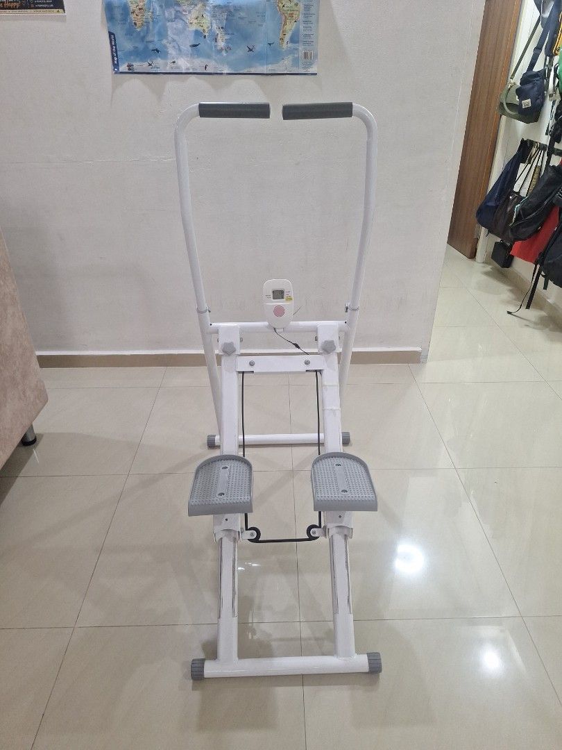 Stepper (Category: Cardio & Fitness Machines) located in Singapore. Submitted by moonwalker2619 (Listing ID 1470018018, Image 3). Description: - Type: Home exercise stepper with handlebars - Color: White with grey pedals - Features: Built-in LCD fitness tracker to monitor workout stats - Design: Sturdy metal frame, textured non-slip foot pedals for safety - Condition: Well-maintained and fully functional - Collection: Meetup at Bedok Reservoir Ro
