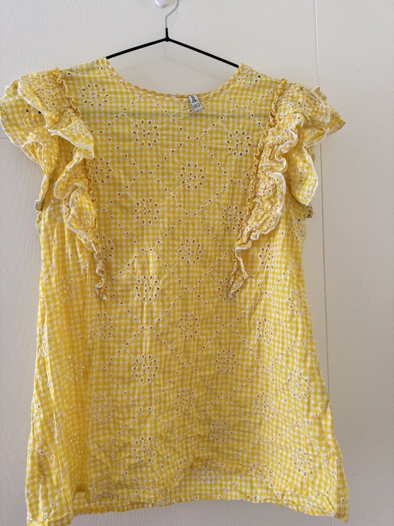 Stradivarius Yellow Gingham Eyelet Ruffle Sleeves Top (Category: Blouses) located in Mandaluyong City. Submitted by trinket.ph (Listing ID 1470141492, Image 1). Description: - Brand: Stradivarius - Size: EUR M / USA M / MEX 28 - Pattern: Yellow & white gingham with eyelet floral embroidery - Details: Ruffle cap sleeves, lightweight fabric - Condition: Great for warm weather.