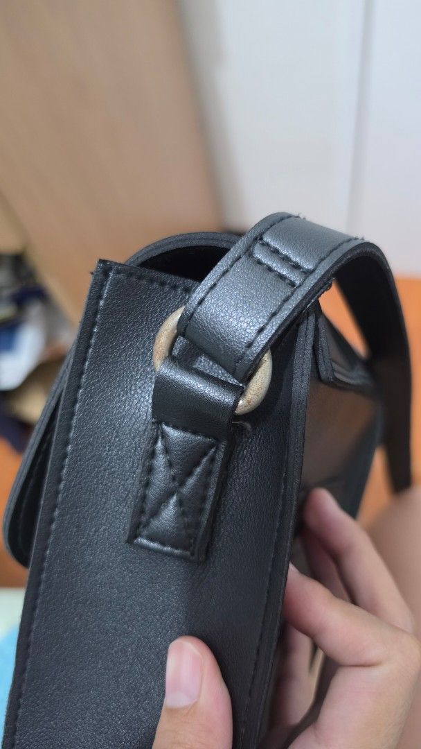 Straightforward Black Slip Sling Bag (Category: Cross-body Bags) located in Manila. Submitted by tori_mama21 (Listing ID 1470095401, Image 3). Description: Issue: Stained steel as seen in pics.