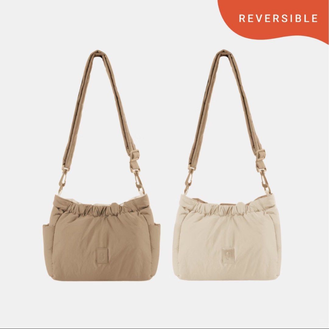 Straightforward Taiko Slingbag (Category: Shoulder Bags) located in Mandaluyong City. Submitted by lianneangeles (Listing ID 1470035979, Image 1). Description: - Style: Reversible shoulder bag in beige and brown - Material: Soft puffer fabric - Features: Adjustable strap and side storage pockets - Versatility: Neutral colorway matches any outfit - Condition: Worn just once, practically spotless.
