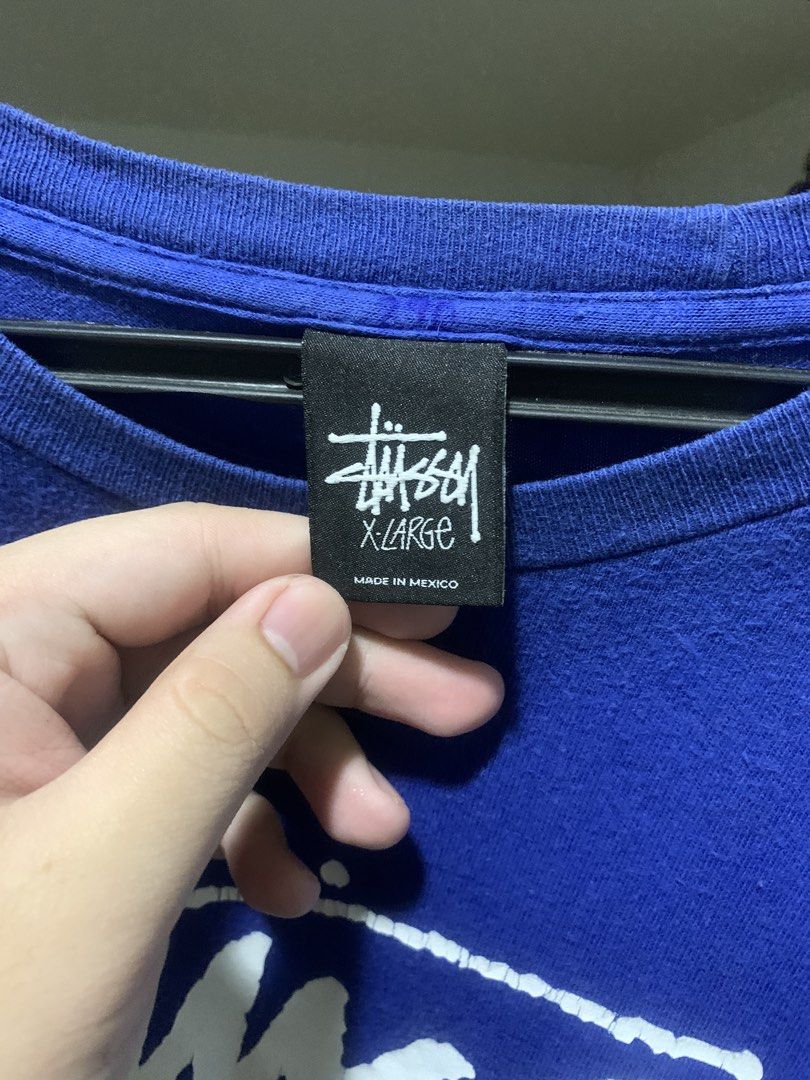 Stüssy Guam Blue tee (Category: Tshirts & Polo Shirts ) located in Davao. Submitted by bygone.threads (Listing ID 1470110640, Image 2). Description: 24.5x30.5 hairline cracks on print needs wash ₱700 FREE SHIPPING.