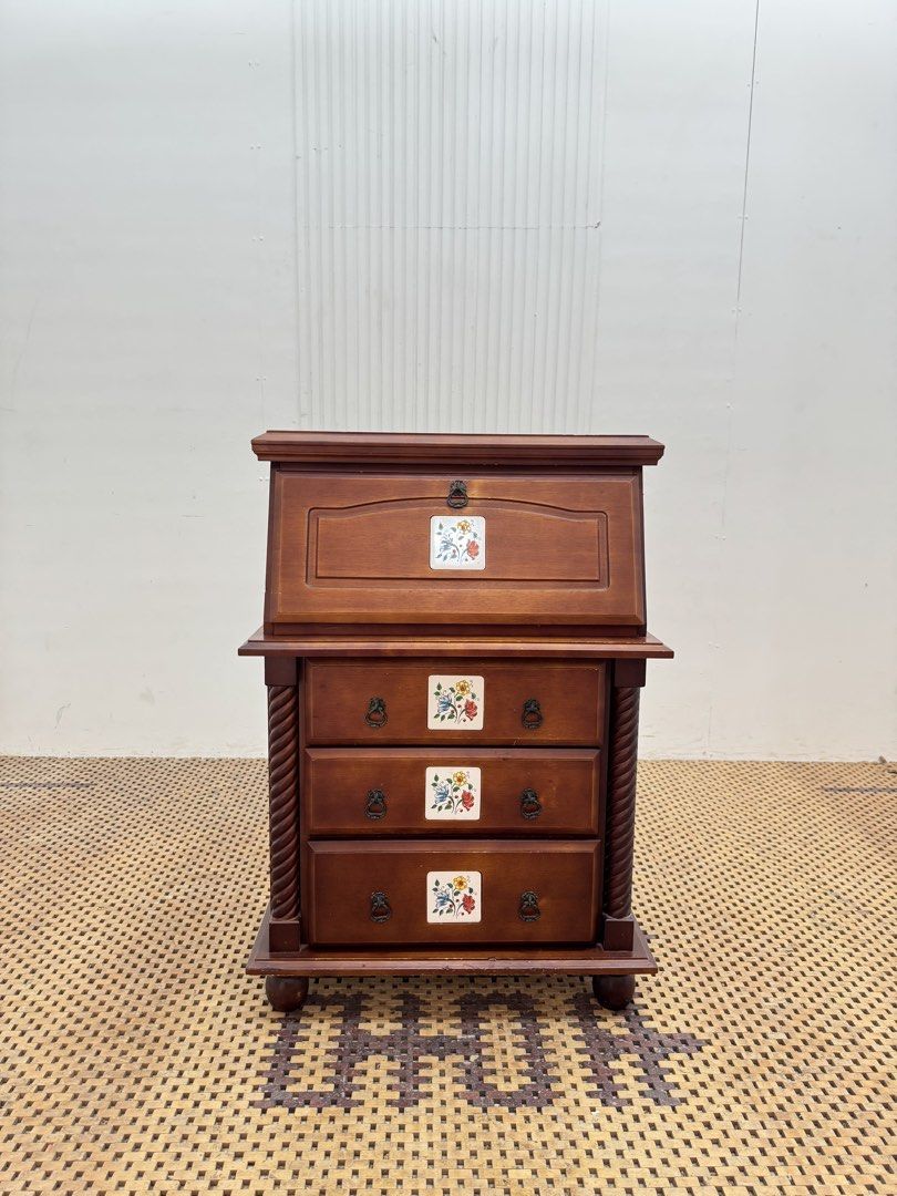 Study desk (Category: Tables & Sets) located in Quezon City. Submitted by matetdevis13 (Listing ID 1470122218, Image 1). Description: Vintage Wooden Secretary Desk with Drop-Front Writing Surface & 3 Drawers Price: 5,500 L24 x W21/14 x H34/23.5 In good condition Code MJS20-R12 The upper front folds down to create a writing/work surface, with storage space inside. The three lower drawers provide additional storage..