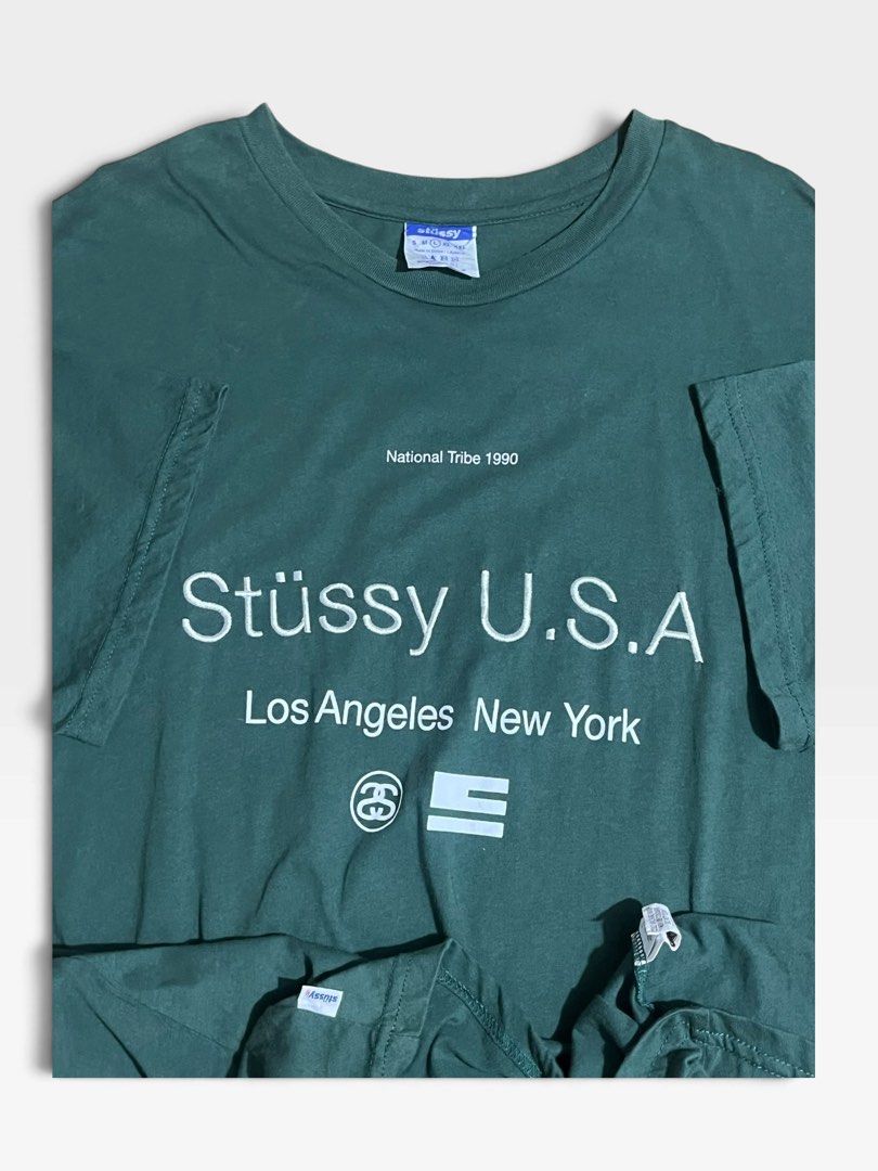 Stussy 2000s National Tribe 1990 Tshirt (Category: Tshirts & Polo Shirts ) located in Tagum. Submitted by graveyard_archive.ph (Listing ID 1470062848, Image 3). Description: L on tag 22x30 Excellent Cr: 9.8/10 No issue‼️ Originating from the mid-2000s era of the iconic streetwear brand, this Stussy piece references the brand’s storied 1990 International Stussy Tribe roots. The chest features high-density embroidery of ‘Stüssy U.S.A.’ alongside sc