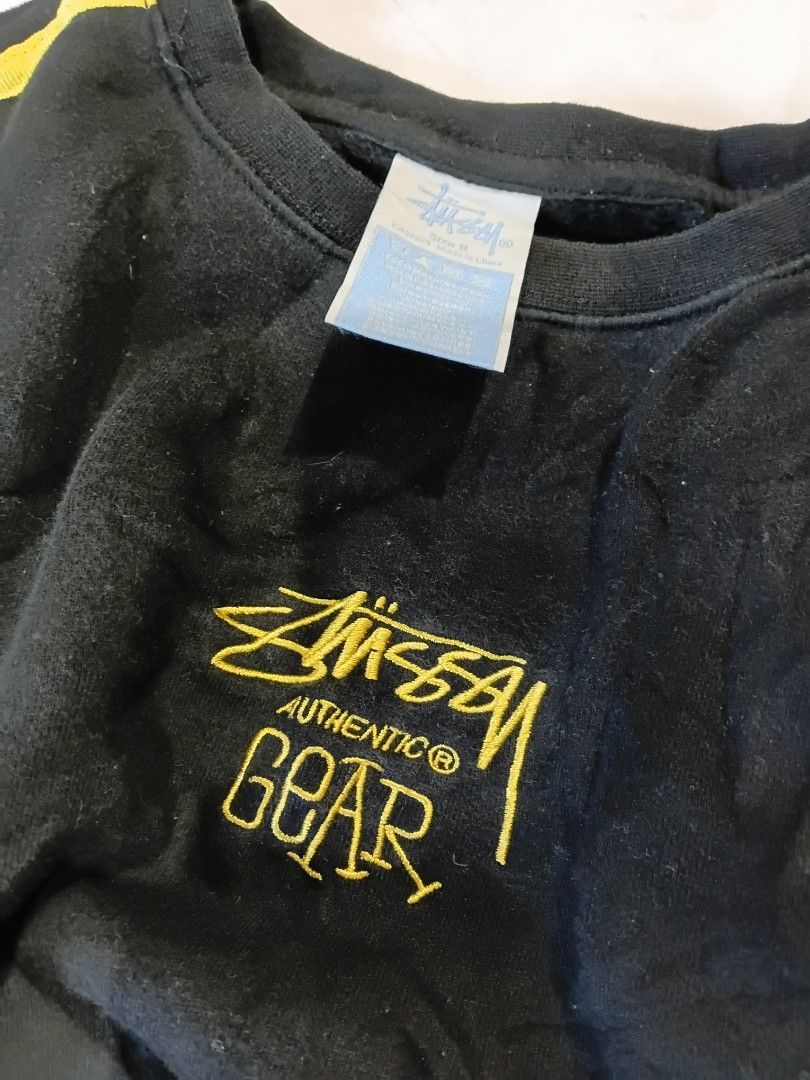 Stussy Authentic Gear Black Sweatshirt Size S (Category: Coats, Jackets and Outerwear) located in Manila. Submitted by grandflower-547aee (Listing ID 1470071985, Image 3). Description: - Brand: Stussy Authentic Gear - Color: Black with yellow embroidery and shoulder piping - Size: S (tag attached) - Material: Cotton with clean interior fleece lining - Condition: Excellent, standard long sleeve pullover fit - Made in China.