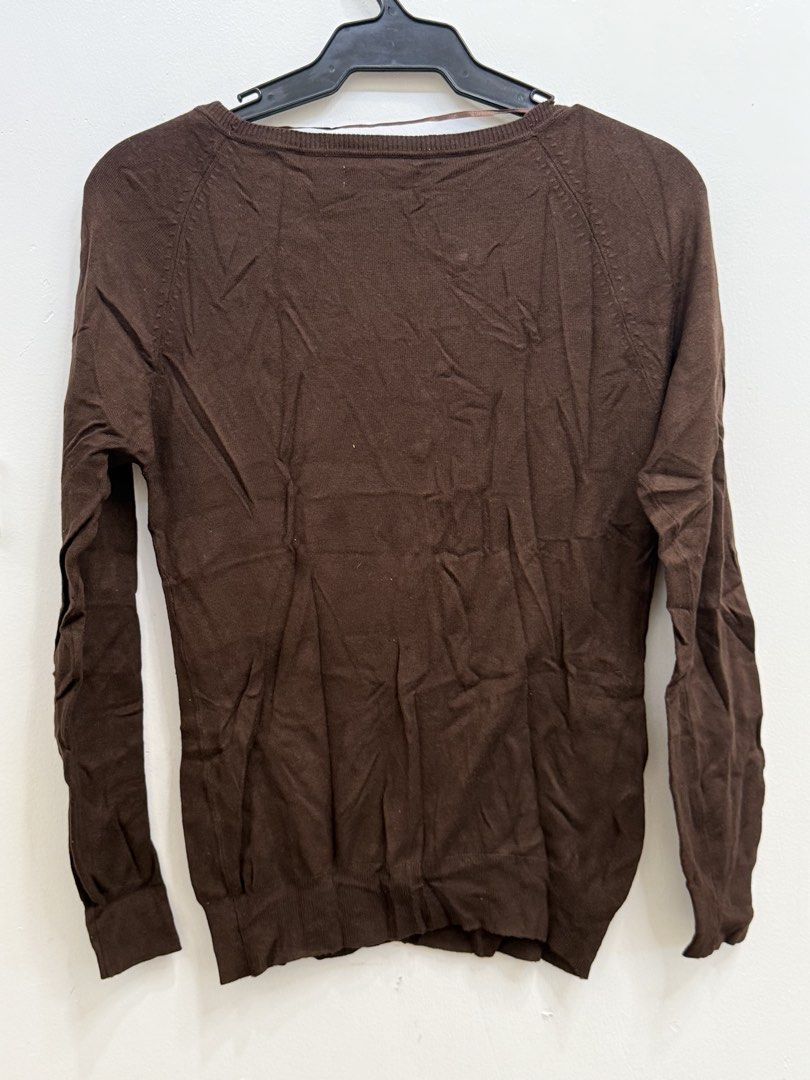 Suiteblanco Brown V-Neck Cardigan Size M (Category: Coats, Jackets and Outerwear) located in Quezon City. Submitted by reivia.vend (Listing ID 1469985935, Image 3). Description: - Brand: Suiteblanco - Size: M (tag on collar) - Color: Brown - Material: Knit - Style: V-neck with front buttons, long sleeves, ribbed cuffs and hem - Origin: Made in Bangladesh - Condition: Classic basic piece, easy to match with different outfits.