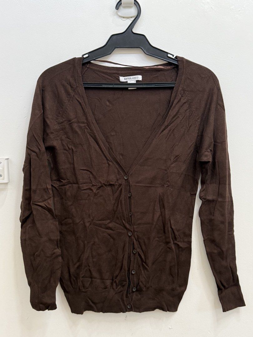 Suiteblanco Brown V-Neck Cardigan Size M (Category: Coats, Jackets and Outerwear) located in Quezon City. Submitted by reivia.vend (Listing ID 1469985935, Image 1). Description: - Brand: Suiteblanco - Size: M (tag on collar) - Color: Brown - Material: Knit - Style: V-neck with front buttons, long sleeves, ribbed cuffs and hem - Origin: Made in Bangladesh - Condition: Classic basic piece, easy to match with different outfits.