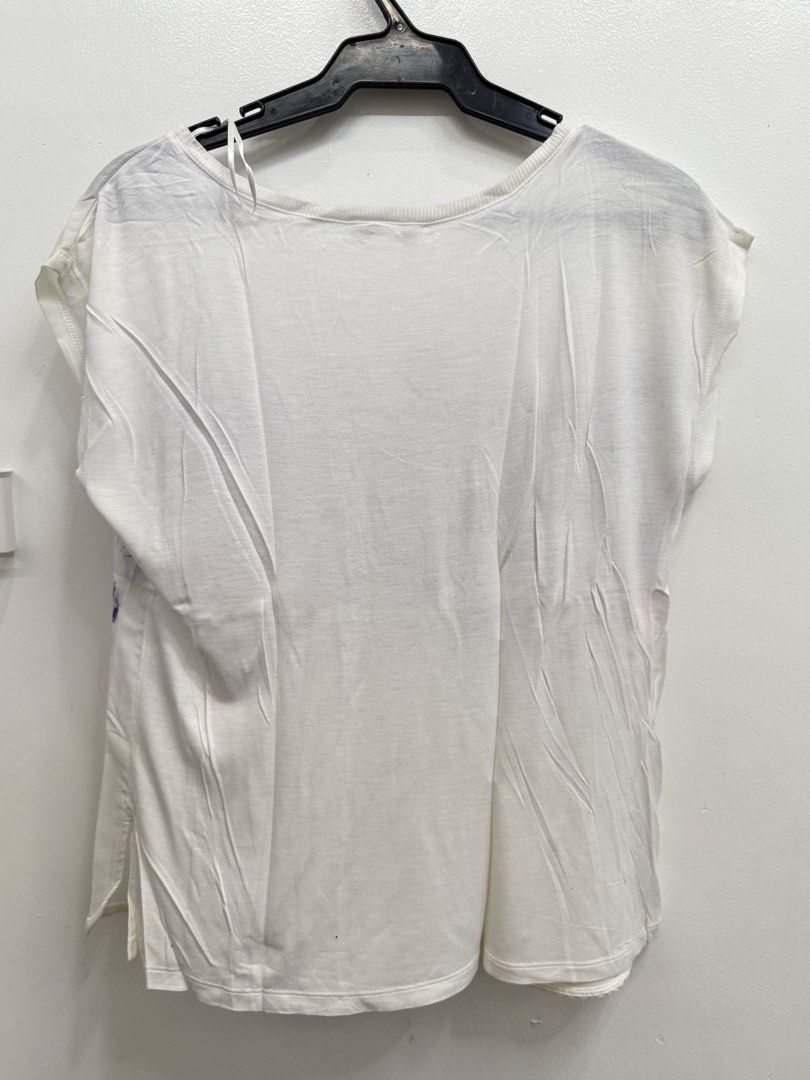 Suiteblanco White Floral Top with Typography Size M (Category: Blouses) located in Quezon City. Submitted by reivia.vend (Listing ID 1469987665, Image 3). Description: - Brand: Suiteblanco - Size: M - Made in Portugal - Design: Watercolor floral front graphic with 'Good things take time' text and a plain white back - Details: Ribbed round neckline, short sleeves - Style: Casual and easy to pair with jeans or skirts - Condition: Excellent.