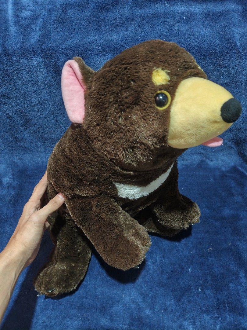 Sun Bear Stuffed Toy Plush Brown (Category: Plushies & Soft Toys) located in Manila. Submitted by kirstentoyshub (Listing ID 1470016142, Image 2). Description: - Adorable brown sun bear plush toy - Features iconic yellow chest marking and pink inner ears - Made with soft, fuzzy fabric all over - Cute details include dark bead eyes and a playful sticking-out tongue - Great gift for kids or addition to any plush collection.