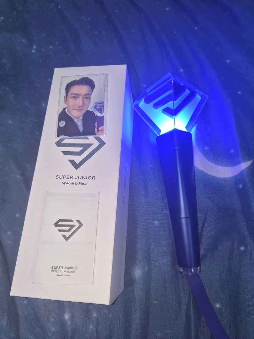 SUPER JUNIOR LIGHTSTICK (UNSEALED) (Category: K-Wave Merchandise) located in Caloocan City. Submitted by mexyne (Listing ID 1470058617, Image 2). Description: - Item: SUPER JUNIOR Official Fanlight Special Edition (Unsealed) - Condition: Good, tested and fully working - Features: Iconic blue LED lighting, sleek geometric design - Inclusions: Comes with original packaging box - Perfect for: Super Junior concerts, fan meetings, and collections **wi
