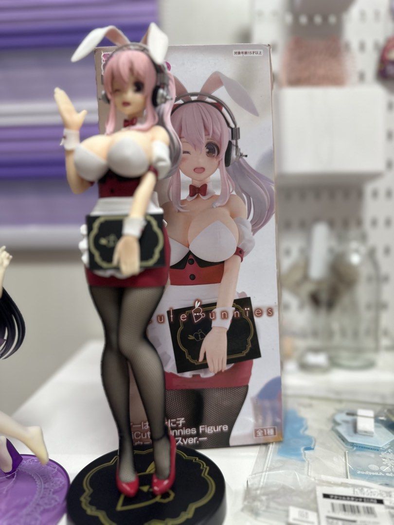 Super Sonico figure (Category: Designer & Blind Box Toys) located in Manila. Submitted by silentfire.54ea36 (Listing ID 1470116805, Image 1). Description: - Authentic anime figure imported from Japan - Features a pink-haired bunny girl in a detailed maid outfit holding a tray - Includes realistic mesh stockings and a sleek black round base - Original box included (shown right behind the figure) - Clean condition, ideal for shelf display - Adult c