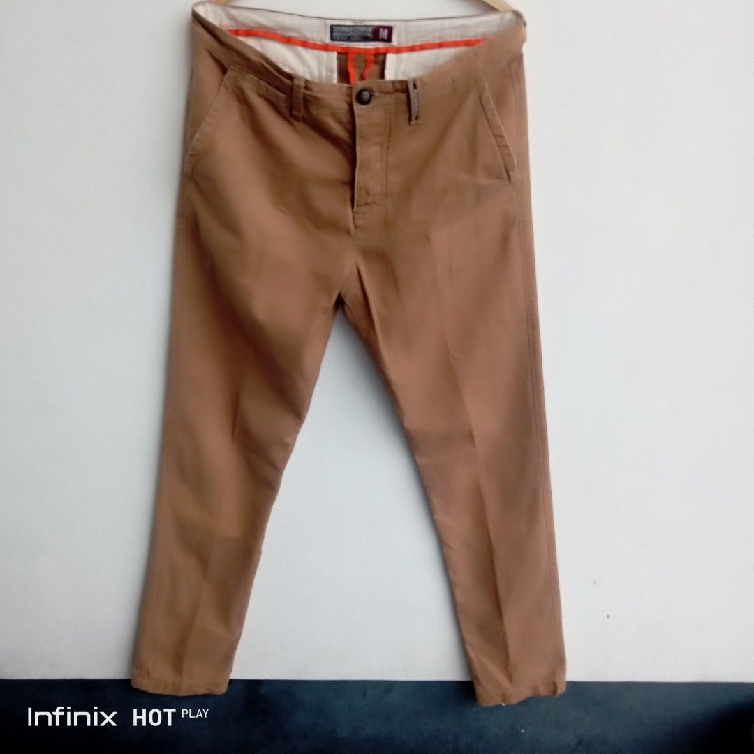 Superdry Company Slim Chinos Brown Size M (Category: Chinos) located in Manila. Submitted by rhegsthrifted (Listing ID 1470047005, Image 1). Description: ⚡💵PRICE : 400.00 [👉 Free Shipping Via JnT 👌] - Brand: Superdry Company - Style: Slim chinos / utility style - Color: Brown with vibrant orange inner waistband tape and piping - Size: Medium (M) -Dimes: •Waist - 32 - 34 • Length - 43 • Inseam - 33 • Hips - 39 - Material: 100% cotton - Origin: 