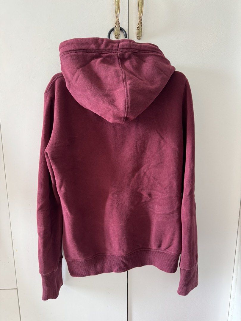 Superdry Hoodie Maroon (Category: Coats, Jackets and Outerwear) located in Antipolo. Submitted by ervinknows (Listing ID 1469953735, Image 2). Description: - Brand: Superdry (Orange Label) - Color: Rich Maroon - Material: Comfortable cotton blend - Design: Embroidered logo on chest, branded inner neckline tape - Features: Full zip front, adjustable drawstring hood, front pouch pockets - Finish: Ribbed cuffs and hem for a snug fit - Origin: Made i