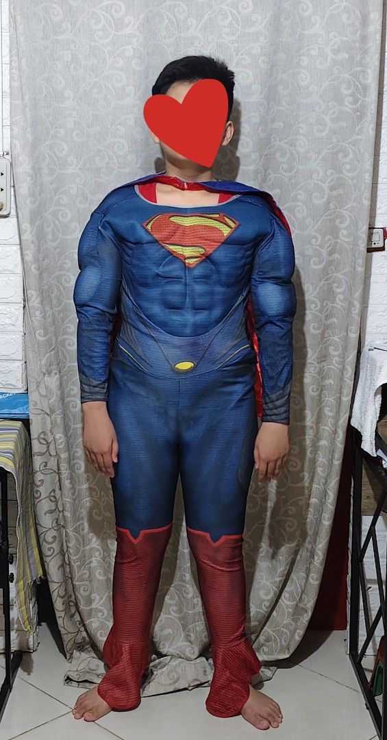 Superman Muscle Costume With Cape (Category: Babies & Kids Fashion) located in Manila. Submitted by duffy-080 (Listing ID 1470084402, Image 2). Description: - Superman costume with built-in muscle padding on chest and arms - Classic red and blue jumpsuit design with attached red boot covers - Includes detachable blue cape with the iconic yellow Superman shield logo - Easy-to-wear back zipper closure - Perfect for dress-up parties, Halloween, tric