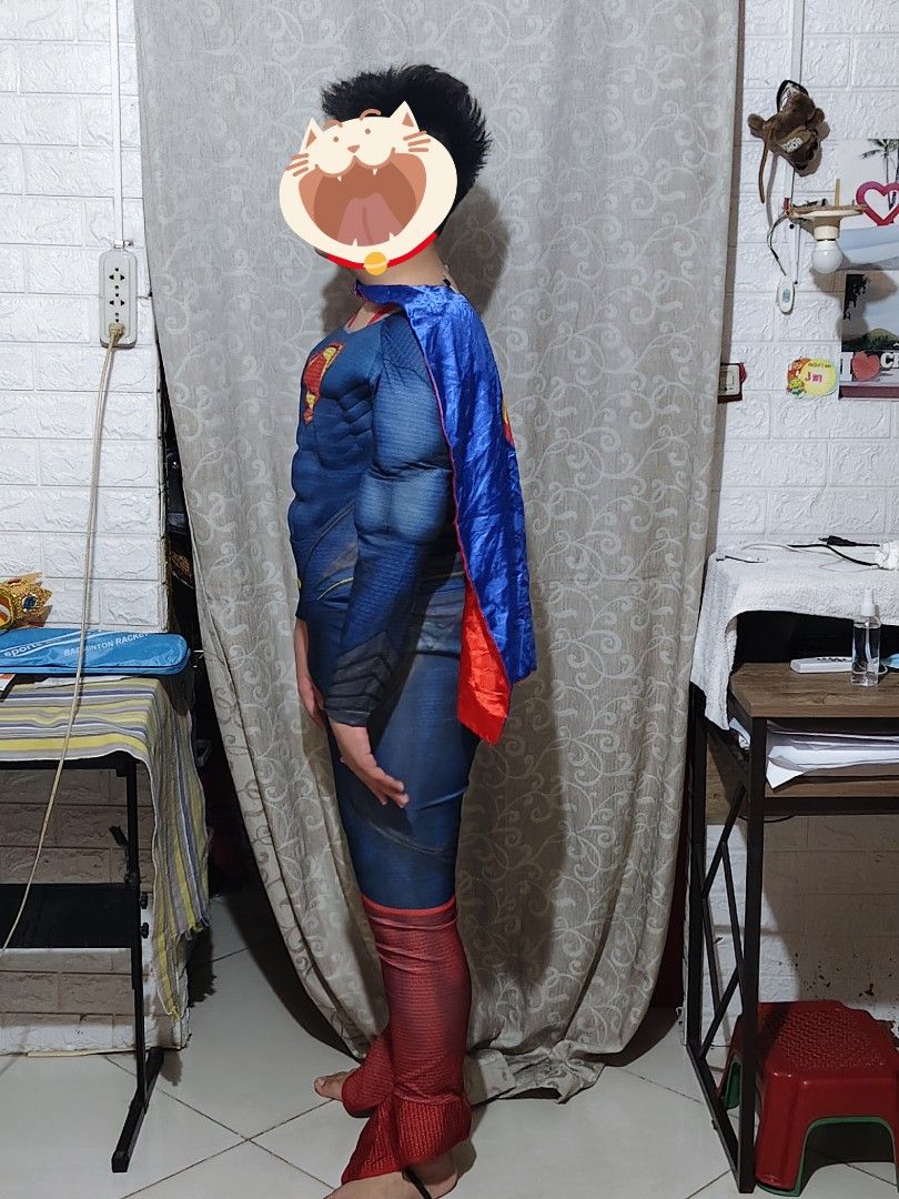Superman Muscle Costume With Cape (Category: Babies & Kids Fashion) located in Manila. Submitted by duffy-080 (Listing ID 1470084402, Image 3). Description: - Superman costume with built-in muscle padding on chest and arms - Classic red and blue jumpsuit design with attached red boot covers - Includes detachable blue cape with the iconic yellow Superman shield logo - Easy-to-wear back zipper closure - Perfect for dress-up parties, Halloween, tric