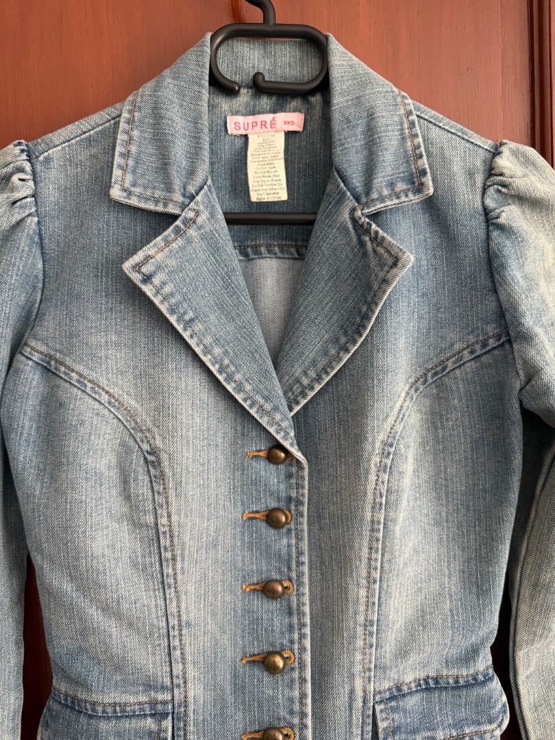 Supré Denim Jacket Blazer Vintage Style (Category: Coats, Jackets and Outerwear) located in Pasig City. Submitted by im_oreo (Listing ID 1469962429, Image 2). Description: - Bought in Melbourne Australia - Can fit XXS to XS - Pick up or courier at the buyer’s expense - Brand: Supré - Style: Light wash denim blazer with structured fit and retro vibe - Details: Lapel collar, long sleeves, front button closure with vintage-style brass buttons, and t