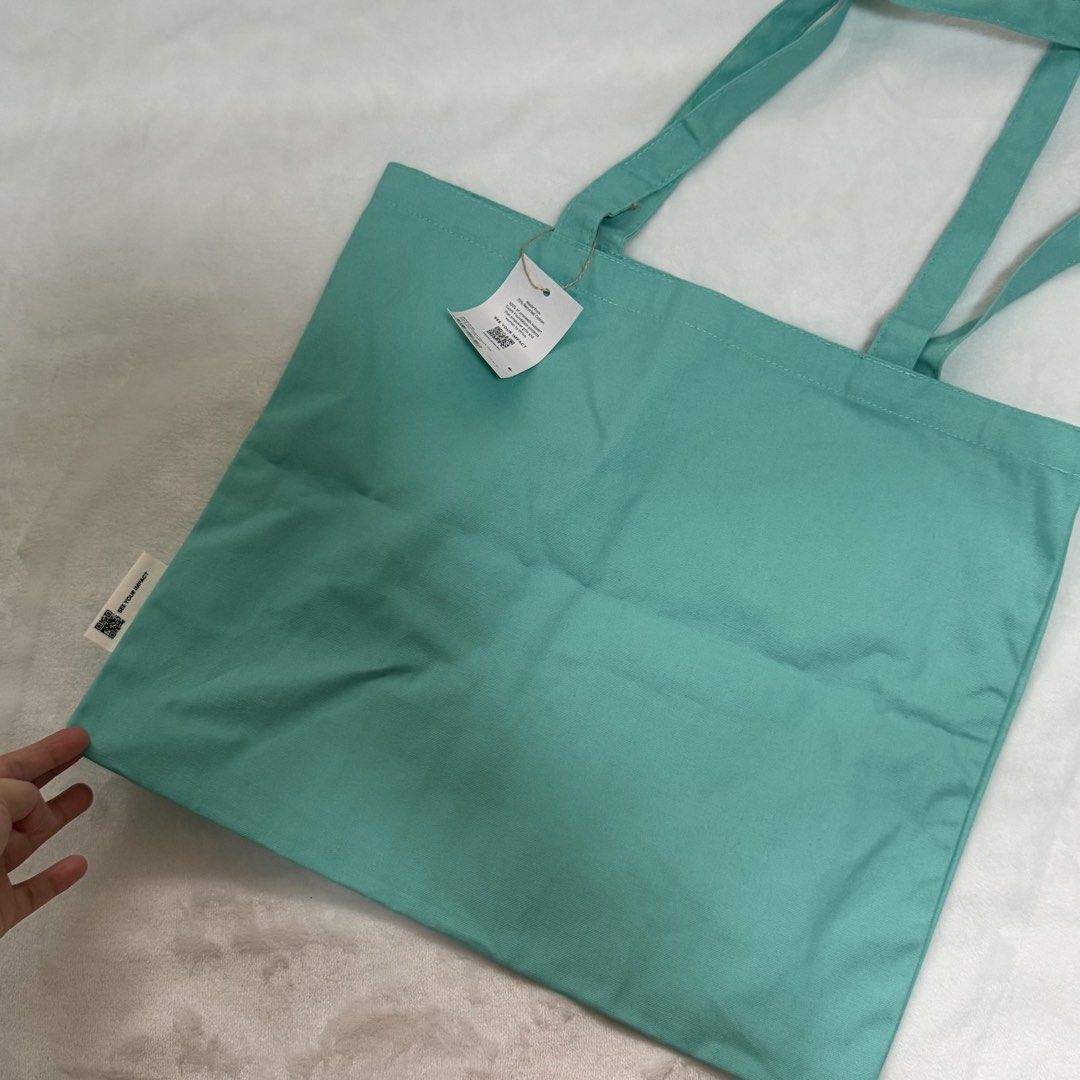 Supré Tote Bag (Category: Tote Bags) located in Quezon City. Submitted by lovedbysia (Listing ID 1469976551, Image 3). Description: - Brand new with tags still attached - Color: Mint green with a bright pink Supré logo - Great for daily shopping, school, work, or running errands.