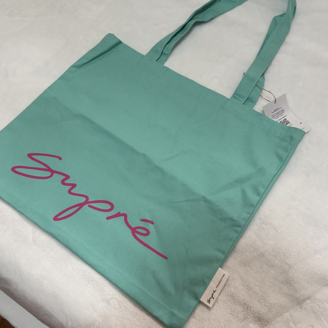 Supré Tote Bag (Category: Tote Bags) located in Quezon City. Submitted by lovedbysia (Listing ID 1469976551, Image 2). Description: - Brand new with tags still attached - Color: Mint green with a bright pink Supré logo - Great for daily shopping, school, work, or running errands.