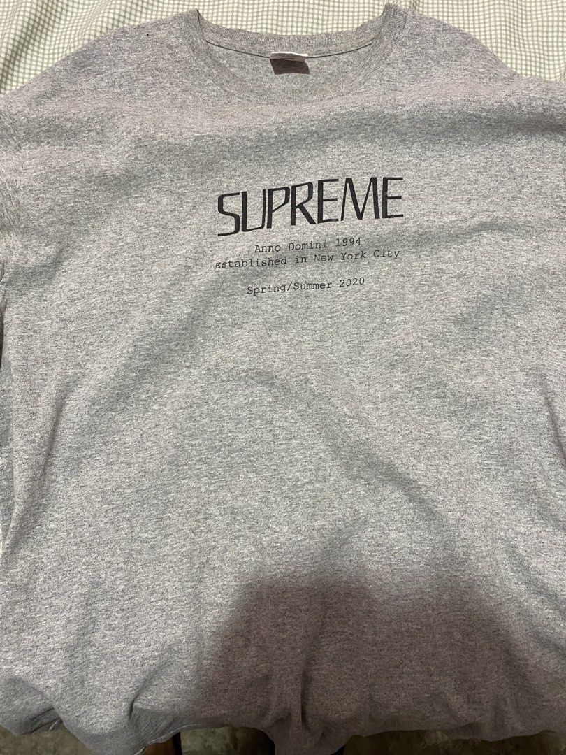 Supreme Anno Domini 1994 Tee Grey Size L (Category: Tshirts & Polo Shirts ) located in Manila. Submitted by warmmountain-f38a (Listing ID 1469987025, Image 1). Description: - Brand: Supreme - Item: Anno Domini 1994 Tee - Collection: Spring/Summer 2020 (SS20) - Color: Heather Grey with black front text print - Size: Large - Material: 90% cotton, 10% polyester blend (Made in USA).