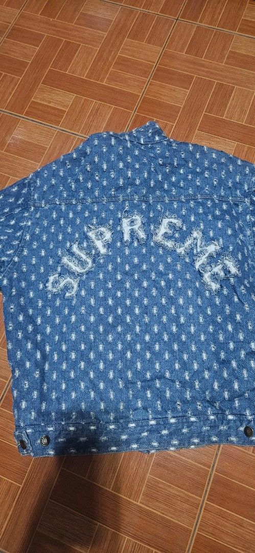 Supreme Distressed Denim Jacket Blue Size XL (Category: Coats, Jackets and Outerwear) located in Santa Maria. Submitted by rommelmateo (Listing ID 1470104606, Image 1). Description: - Brand: Supreme - Item: Denim Jacket - Color: Blue - Size: XL - Material: 100% Cotton - Design: All-over distressed pattern with frayed details and large Supreme logo on the back panel - Closure: Button-up front with metal hardware - Condition: Excellent / Ready to w