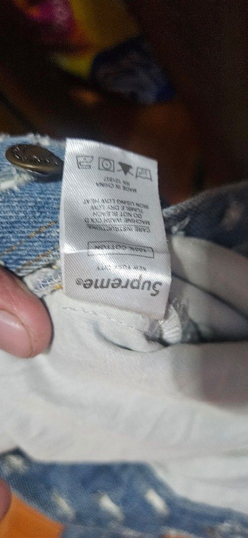 Supreme Distressed Denim Jacket Blue Size XL (Category: Coats, Jackets and Outerwear) located in Santa Maria. Submitted by rommelmateo (Listing ID 1470104606, Image 3). Description: - Brand: Supreme - Item: Denim Jacket - Color: Blue - Size: XL - Material: 100% Cotton - Design: All-over distressed pattern with frayed details and large Supreme logo on the back panel - Closure: Button-up front with metal hardware - Condition: Excellent / Ready to w