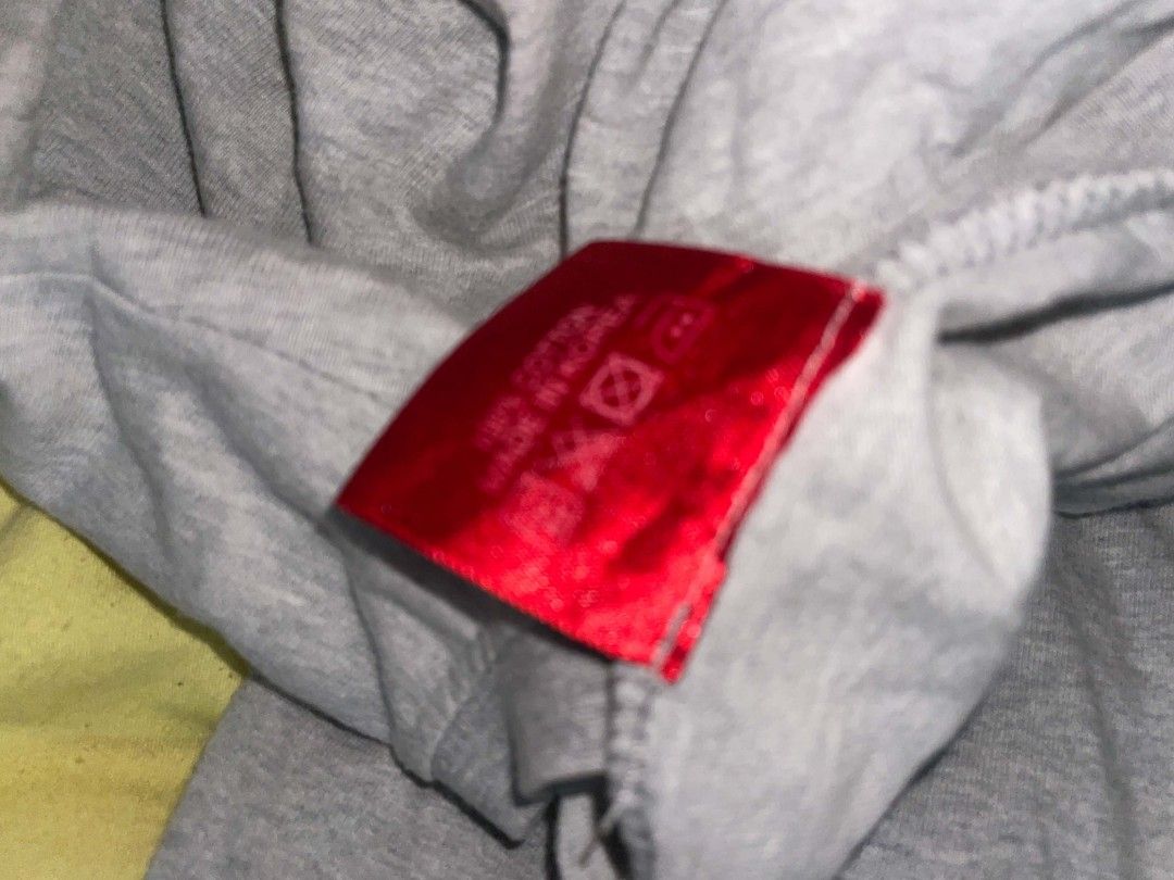 Supreme Grey Long Sleeve T-Shirt (Category: Tshirts & Polo Shirts ) located in Tagbilaran City. Submitted by yxngchris.00 (Listing ID 1469974360, Image 3). Description: - Color: Grey with dark grey crew neck - Branding: Red Supreme box logo on chest, large white Supreme text near back hem, and small embroidered logo on sleeve cuff - Material: 100% cotton, made in Korea - Fit: Regular fit, standard long sleeve - Condition: Brand new/Mint (ready to