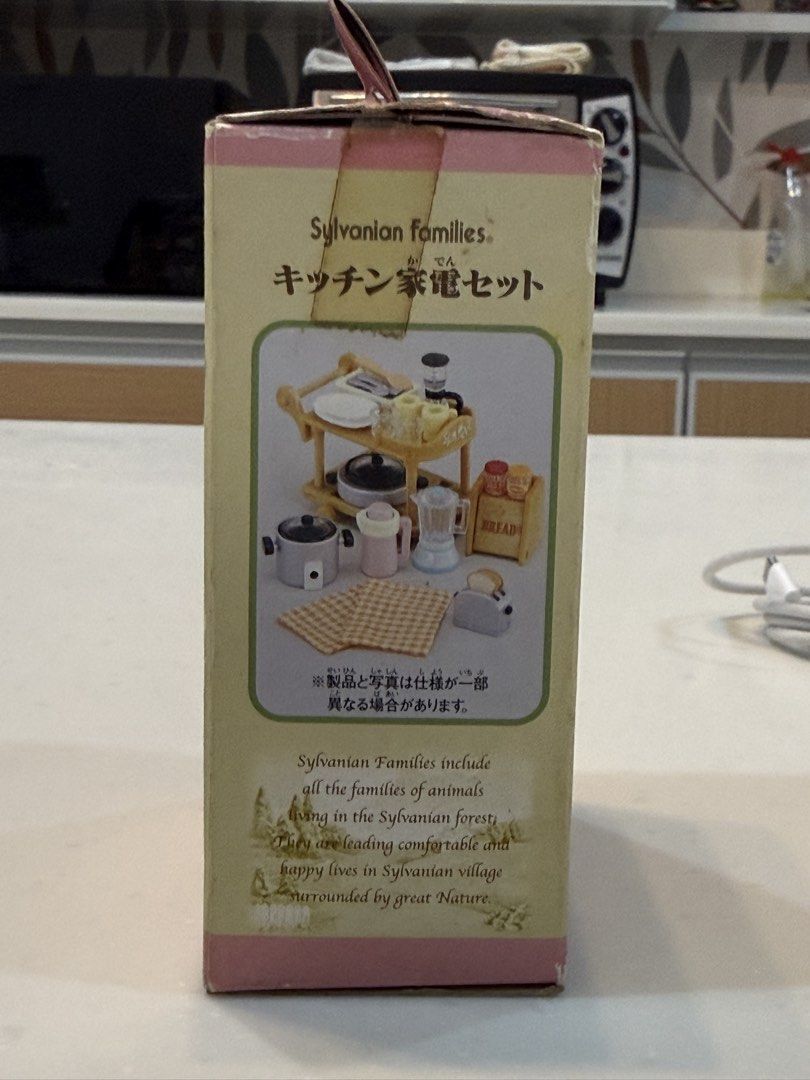 Sylvanian Families Kitchen Appliance Set (Category: Figurines & Statues) located in General Trias. Submitted by brightdog-224c (Listing ID 1470091564, Image 3). Description: Inclusions: Serving cart, bread box, rice cooker, blender, coffee maker, toaster, hot plate, kettle, tableware, placemats, and various kitchen utensils. Minor shelf wear with light edge creasing but contents are complete inside..