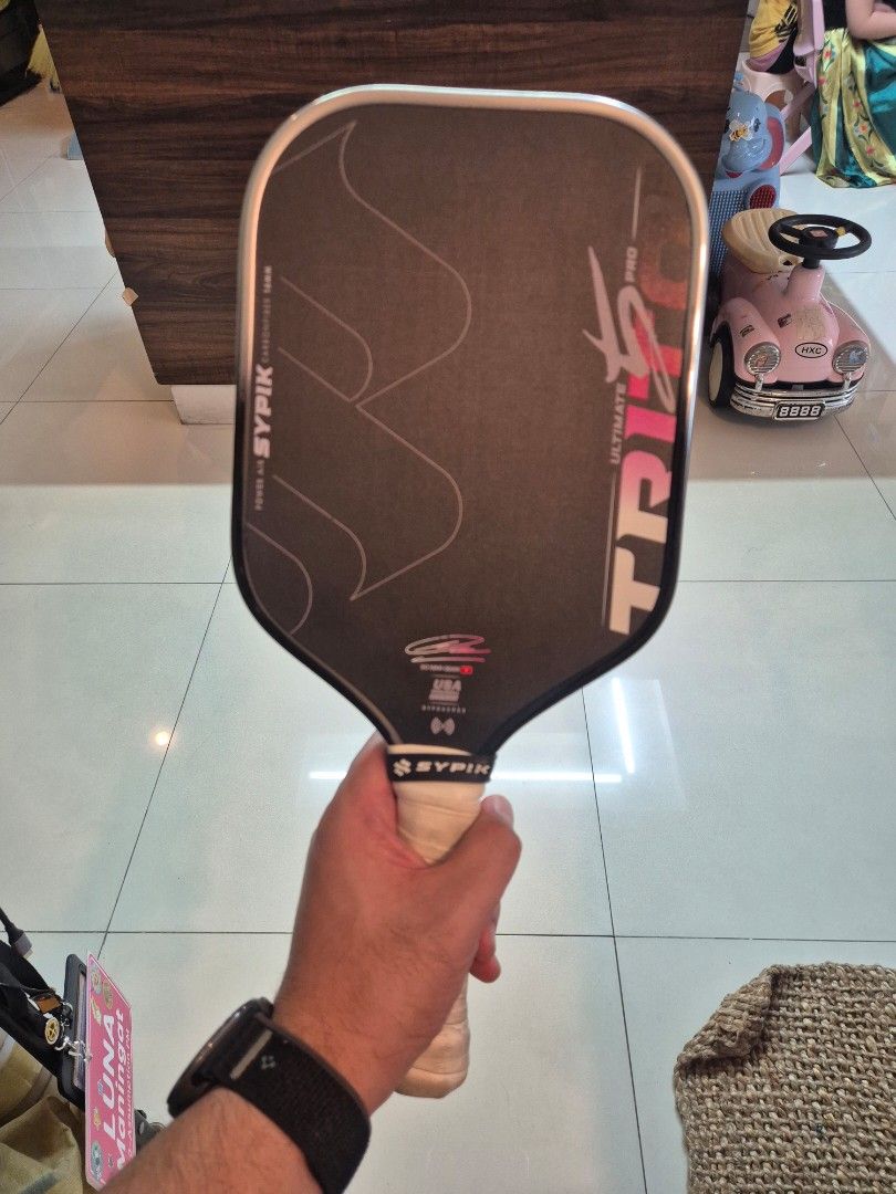 Sypik Triton 5 (Category: Racket and Ball Sports) located in San Juan City. Submitted by chibuman (Listing ID 1469987219, Image 1). Description: [FOR SALE] Sypik Triton 5 Ultimate Pro 16mm (Sparkline) ​Price: ₱7,000 Condition: Excellent / Barely used (~15 hours max) Colorway: Sparkline Inclusions: Paddle + matching Sparkline neoprene sleeve + installed clear edge guard ​Quick Details ​Origin: Bought at Unity Pickleball Store in Da Nang, Vietnam l