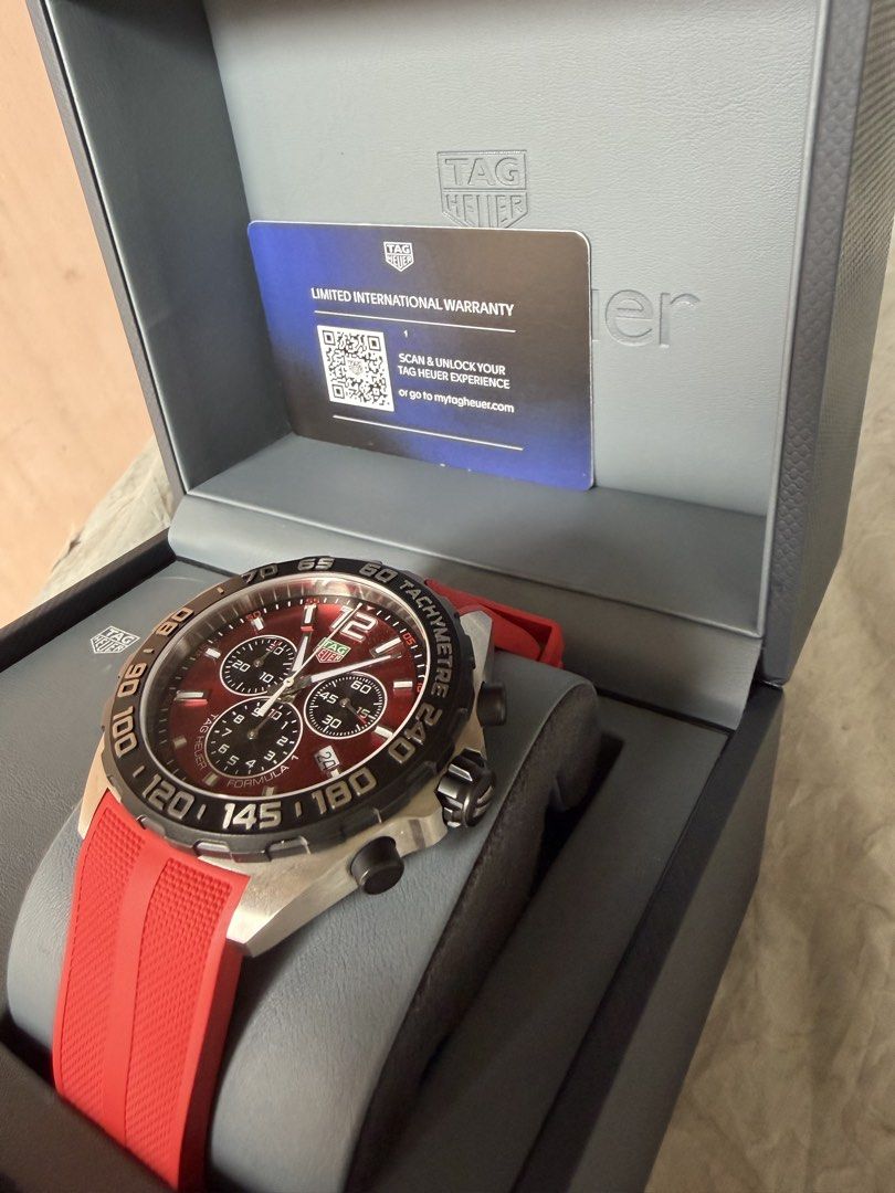 TAG Heuer Formula 1 Red Chronograph Watch (Category: Luxury Watches) located in Pasig City. Submitted by jayceess (Listing ID 1470095651, Image 2). Description: - Brand: TAG Heuer Formula 1 Chronograph - Dial: Striking red sunray dial with black tachymeter bezel - Strap: Vibrant red rubber strap - Movement: Reliable quartz movement in a stainless steel case - Condition: 9.2/10 - under warrant til 2027 - Inclusions: Complete set with original box,