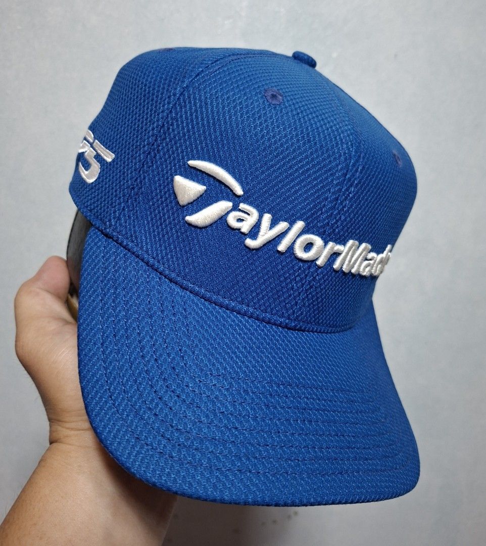 TaylorMade M1 TP5 New Era Blue Golf Hat Cap (Category: Caps & Hats) located in Taguig. Submitted by AlfonsoJaimepreloved (Listing ID 1469971828, Image 2). Description: Taylor Made TP5 M1 Golf Cap New Era 39Thirty Adult / Closed Cap Stretchable (M-L) Embroidered / 100% Polyester Royal Blue Colorway Excellent Used Condition Price : 680 Location : ibayo Tipas Taguig City MOD : Lalamove / LBC / J&T at buyer expense MOP : Gcash Thank you.